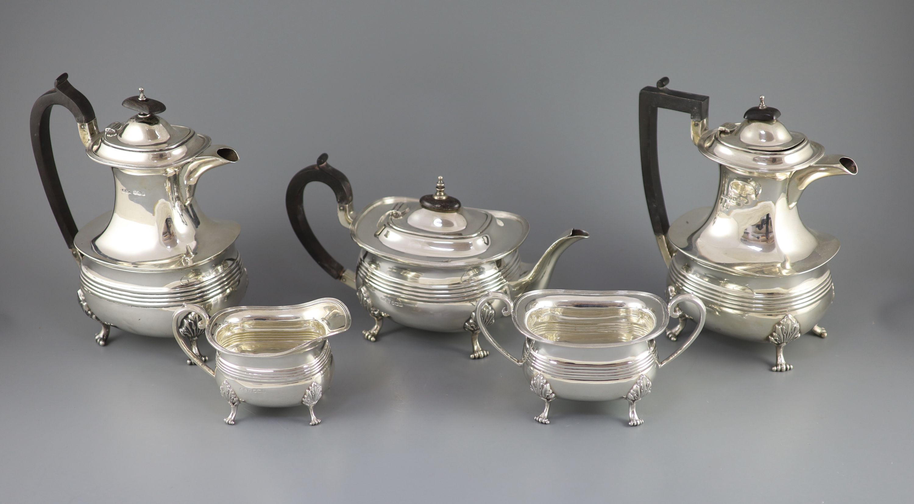 A matched silver five-piece tea service of reeded oval form, Jenkins & Timm, Sheffield 1922-3 and 1925